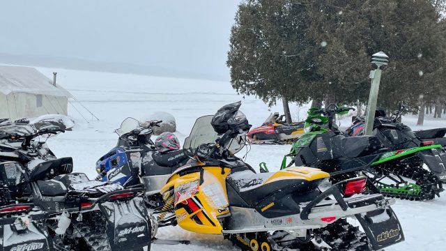 Snowmobiles by Gunflint Lake with tent – Mindy @ GL